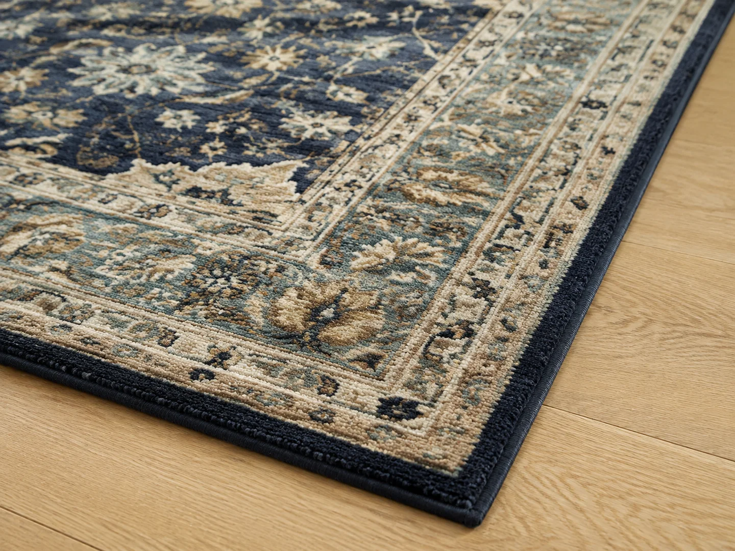 Close editorial view of a clean patterned wool rug